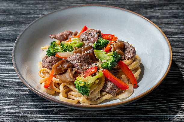 istock Top view of pasta with beef and broccoli. 2231724944