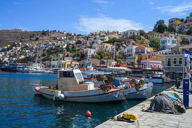 Harbour and traditional coastal buildings, Symi, Greek Islands