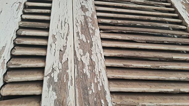 istock Weathered Wooden Shutters with Peeling Paint 2231725844