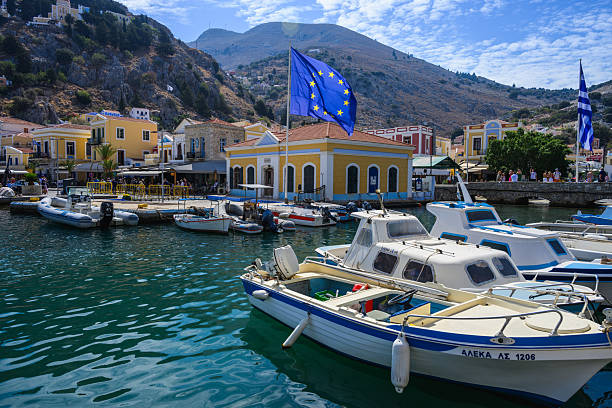 Harbour and traditional coastal buildings, Symi, Greek Islands