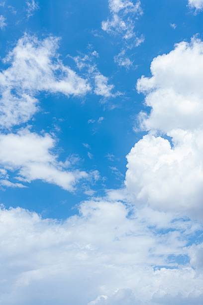 High resolution image of a vibrant blue sky filled with fluffy white cumulus clouds Ideal as a natural background
