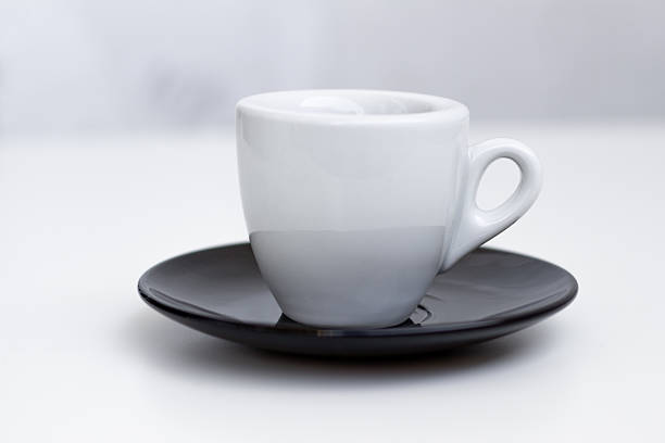 istock Black and white composition with a cup of milk and black coffee 2231727833