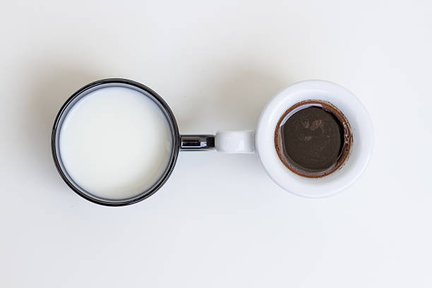 istock Black and white composition with a cup of milk and black coffee 2231727859