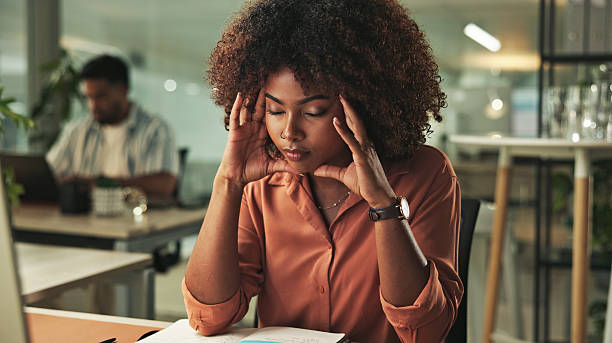 istock Stressed Woman Working Late in a Modern Office Environment 2231732850
