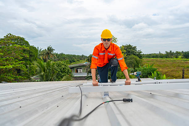 istock Technician in safety uniform and helmet kneeling on a rooftop, using a drill for precise installation work. A scene highlighting safety, professionalism, and technical expertise in construction. 2231734862
