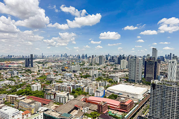 istock Wide city view from skyscraper with clear blue sky and scenic cloud formation. 2231738606