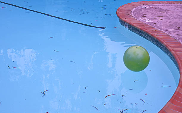 istock Green Ball Floating in Pool 2231742340
