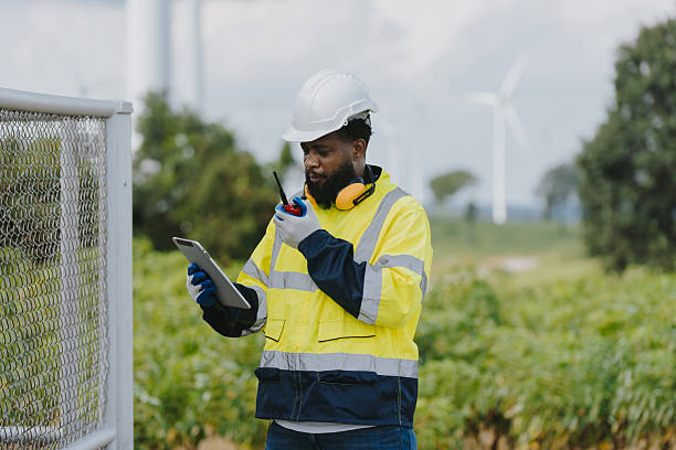 istock Engineers in suits working at wind farm that converts to electricity. Alternative energy concept for clean energy. 2231742537