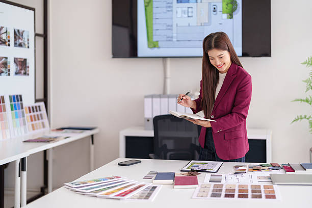 istock Professional Asian woman architect planning modern home interiors developing property design concepts for real estate 2231757654