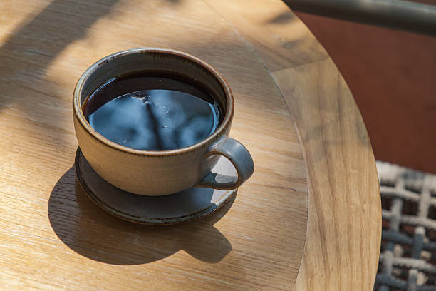 istock hot black coffee on the wooden table at cafe 2231767230