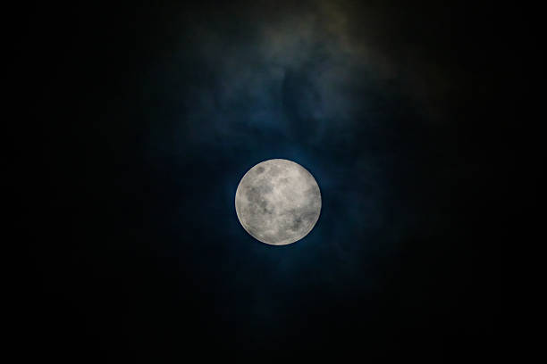 istock full moon in the midnight behind the cloudy sky 2231767769