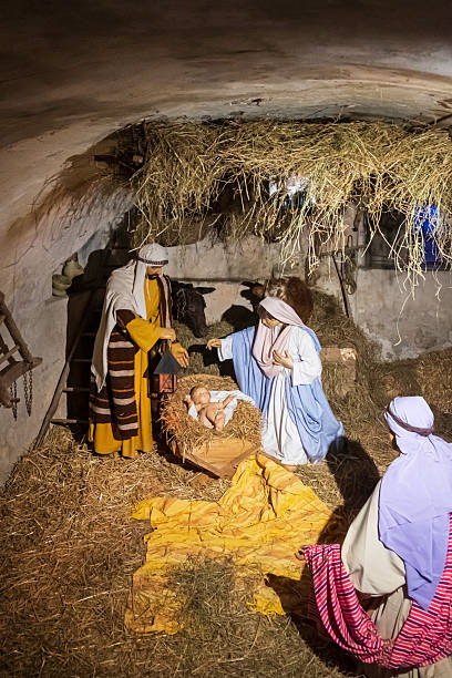 Small images of a clay manger for sale in Catholic stores, for Christmas decorations