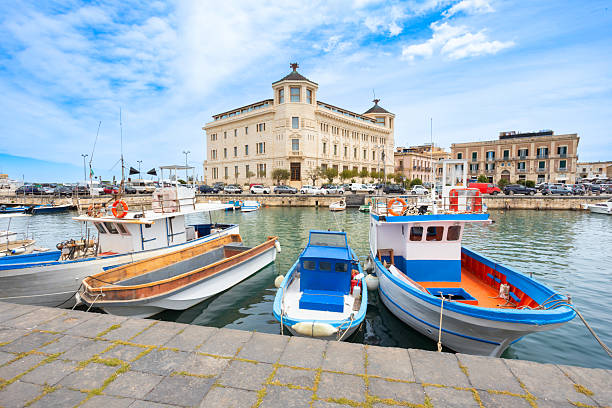 Syracuse city marina and post office building. Siracusa is the second largest city in Sicily, Italy.