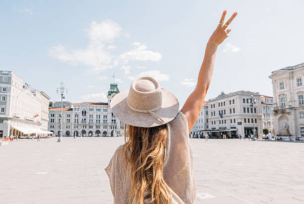 istock Woman Wearing Hat Making Peace Sign Outdoors 2231781069