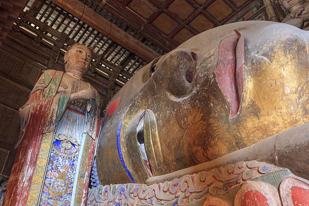 The Nirvana Shakyamuni Buddha at Dafu Temple (also known as Hongren Temple) in Zhangye, Gansu Province, China, is a beautiful representation of the Buddha in repose.