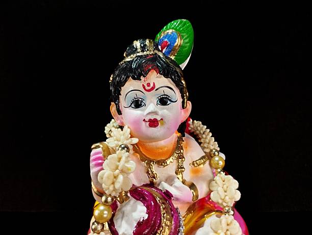 istock Idol of Bal Krishna with Peacock Feather and Garland 2231787150