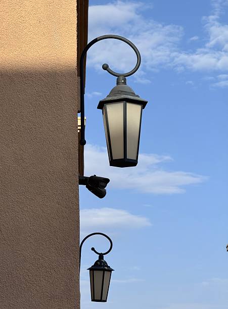 istock Vintage style wall lantern against blue sky 2231788524