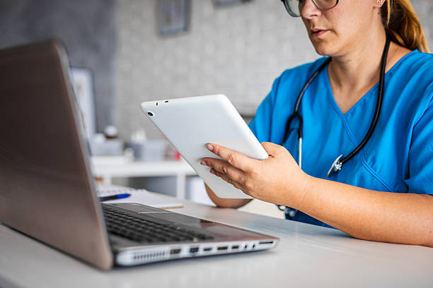istock Healthcare nurse checking medical data on tablet 2231790634
