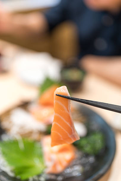 istock Use chopsticks salmon Japanese food 2231795910