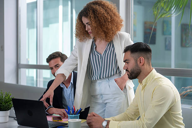 istock Business team analyzing data on laptop in modern office 2231796973