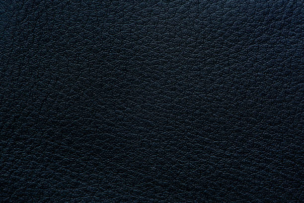 istock Black macro synthetic leather surface,Close-up of synthetic leather texture with fine grain pattern and glossy lighting, ideal for background, textile design, or product mockup. 2231798662