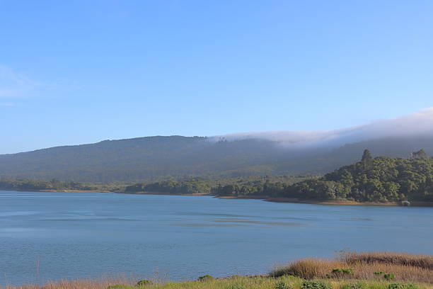 istock Lake Landscape with Rolling Clouds Over Mountains 2231799291