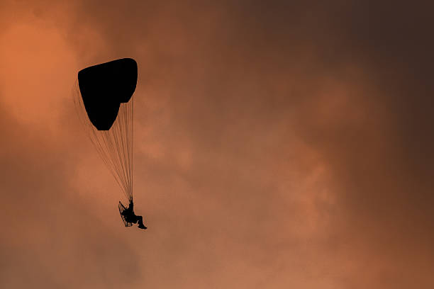Paragliding at altitude when the sun goes down. Tenerife island, Canary archipelago. Spain