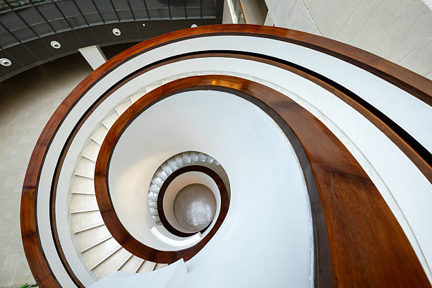 istock A three-dimensional staircase that rotates downwards indoors 2231801525