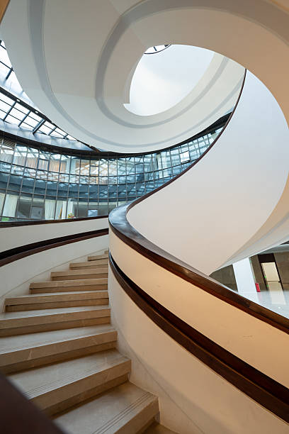 A three-dimensional staircase that rotates downwards indoors