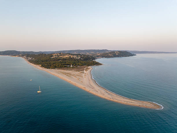 istock Possidi cape, Kassandra, Greece, dividing Aegean sea with sandy beach during summer sunset 2231803241