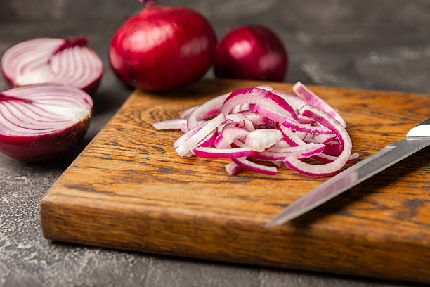 istock Shallot onion on the kitchen table. onion slice. onion rings. Fresh red Onion. Natural, fresh, vegetarian food. Agricultural products. Healthy eating. Vegetables. Farmer's market. 2231804366