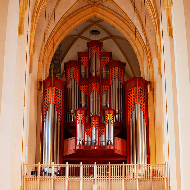 Macro close up depicting different knobs and controls of a church organ inside an old English Anglican church.