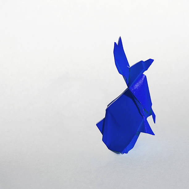 Origami Blue rabbit isolated on white