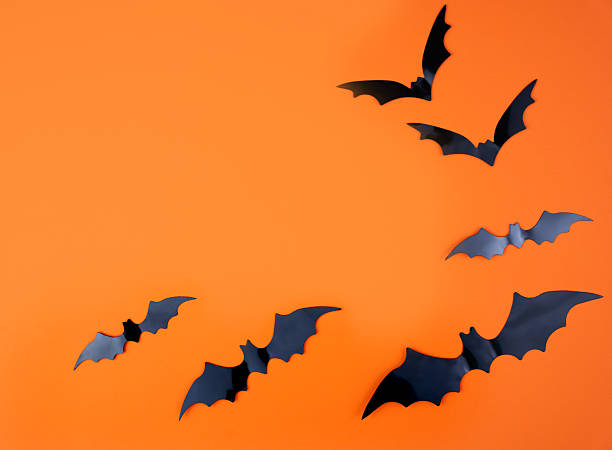 istock Background for Halloween with bats on an orange background. Mockup. Flatlay. Copy space. 2231808231