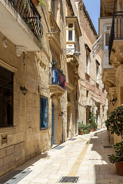istock A narrow pathway between limestone buildings in Birgu, Malta 2231809203