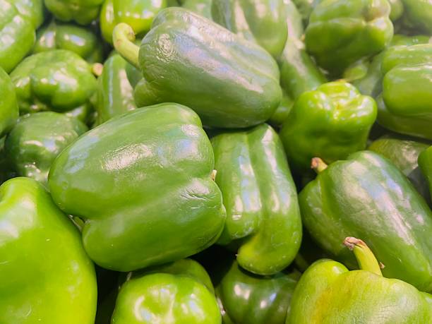 istock Green Bell Peppers Displayed in Local Market 2231810590