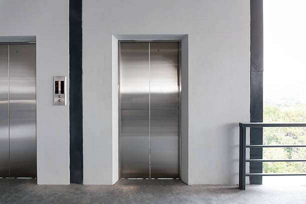 istock Elevator door and concrete floor in high rise building. 2231812191