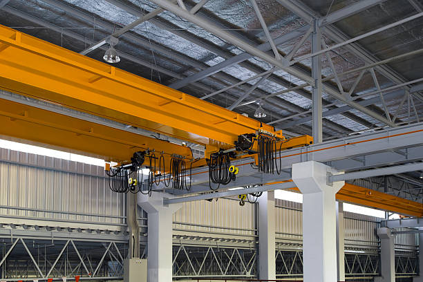 istock Overhead crane or lifting equipment inside factory or warehouse. 2231812564
