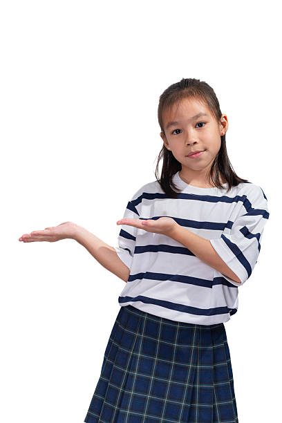 Cute little girl showing empty space with hands isolated on white background