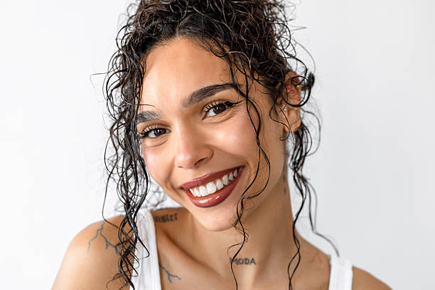 Young and pretty female feeling happy and smiling