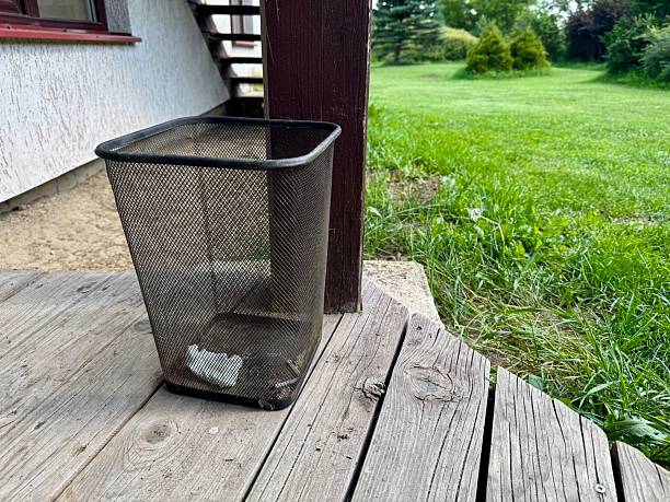istock Empty trash bin on wooden terrace 2231816138