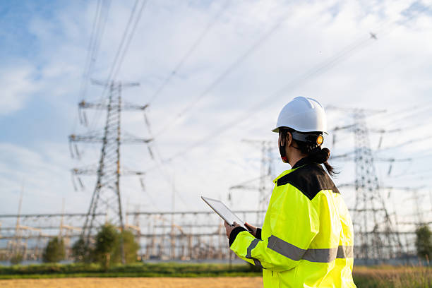 istock Asian female electricity technician is checking high voltage power lines 2231816527
