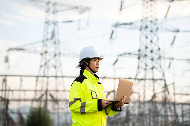 istock Asian female electricity technician is checking high voltage power lines 2231816673