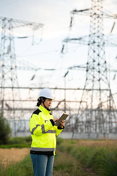 istock Asian female electricity technician is checking high voltage power lines 2231816684