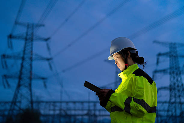 istock Asian female electricity technician is checking high voltage power lines 2231816813