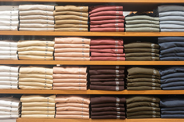 istock Cloths in various base color tone are folded on the shelf. 2231825190