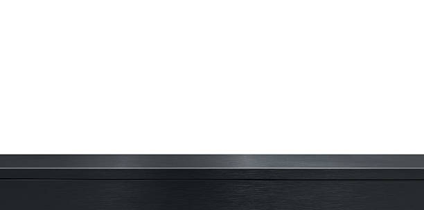 dark black or grey brushed stainless steel counter or table, providing reflective surface ideal as a background for product displayed, industrial counter.