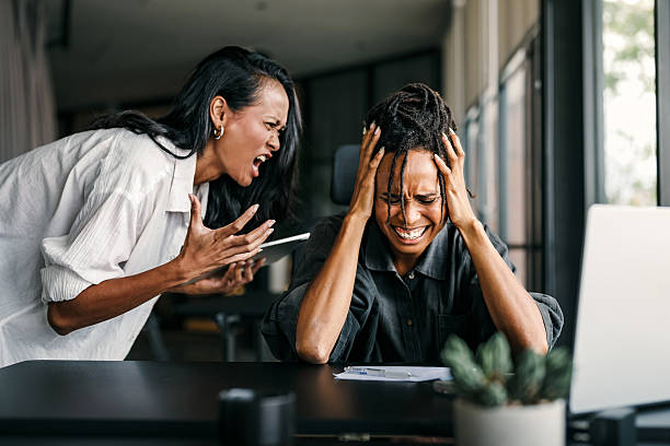 istock Stressful work environment, overtime. Frustrated boss yelling at his subordinate in the office 2231829829