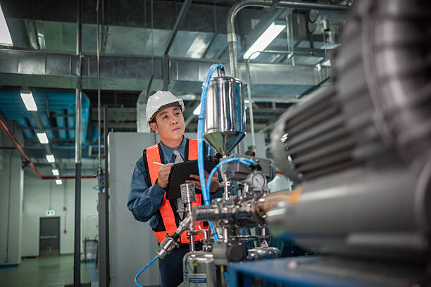 istock Engineers or technicians working extensive metal piping, HVAC systems, industrial equipment suggesting a controlled, well-maintained environment concept. 2231831541