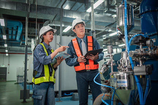 istock Engineers or technicians working extensive metal piping, HVAC systems, industrial equipment suggesting a controlled, well-maintained environment concept. 2231831561